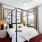 Apartments for Rent Savannah GA - Olmsted Savannah - Bedroom with 4 Windows, White Walls, Wood Flooring, and Ceiling Fan